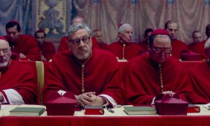 A group of cardinals sit together in Conclave.