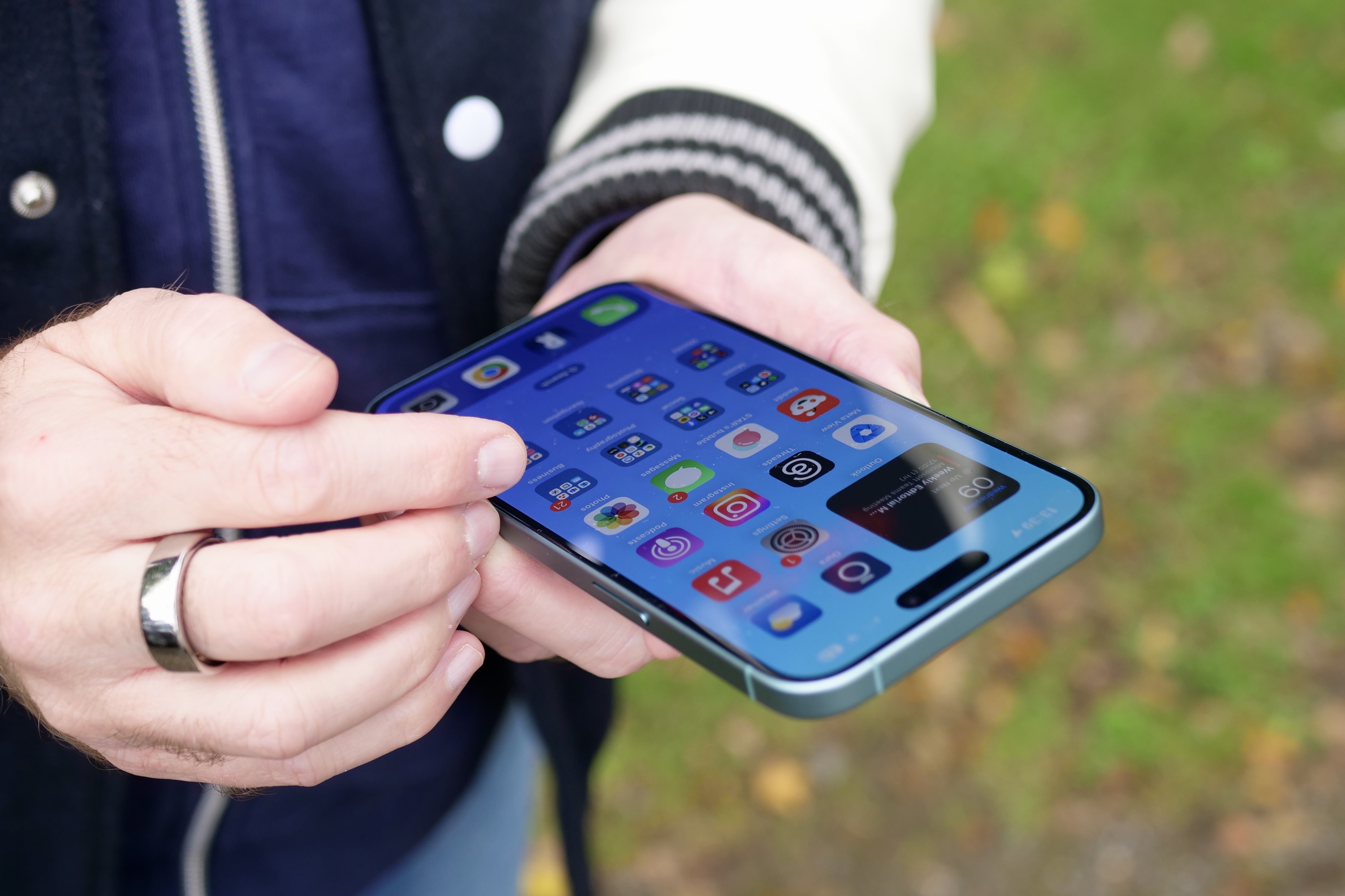 A person using the Apple iPhone 16 Plus.