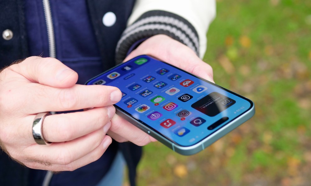 A person using the Apple iPhone 16 Plus.