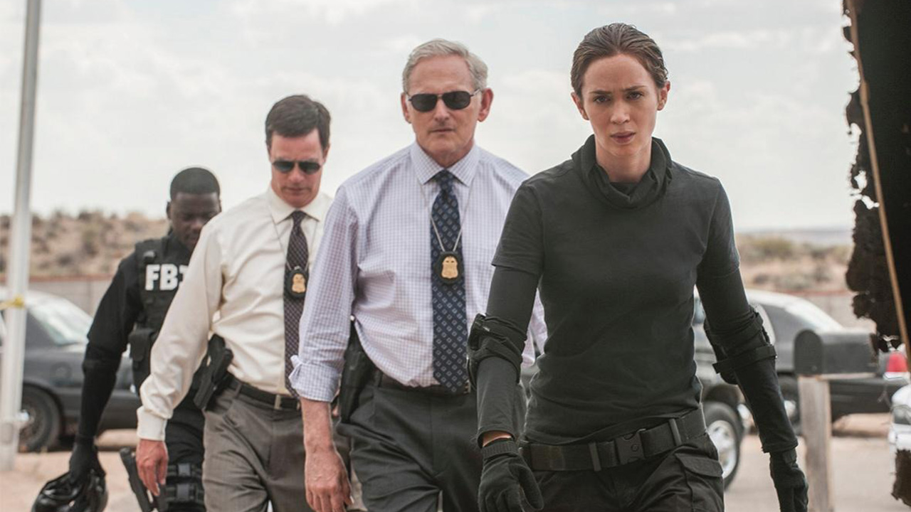 Four agents walk in formation led by Emily Blunt in Sicario.