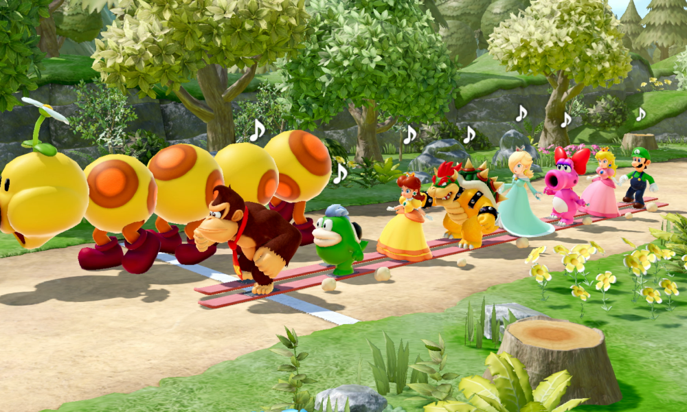 Donkey Kong and friends walk next to a Wiggler in Super Mario Party Jamboree.