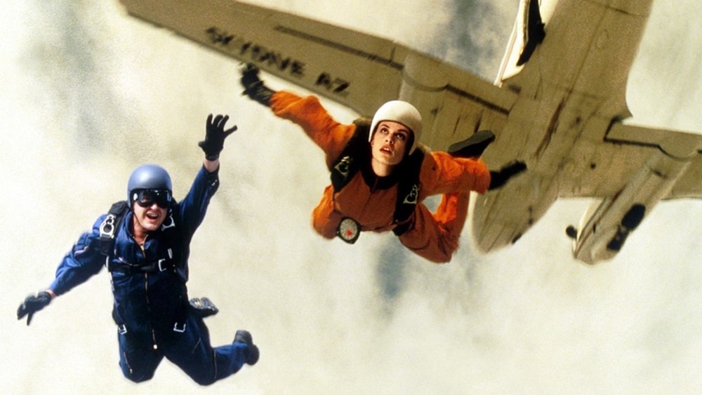 A man and a woman skydive in Terminal Velocity.