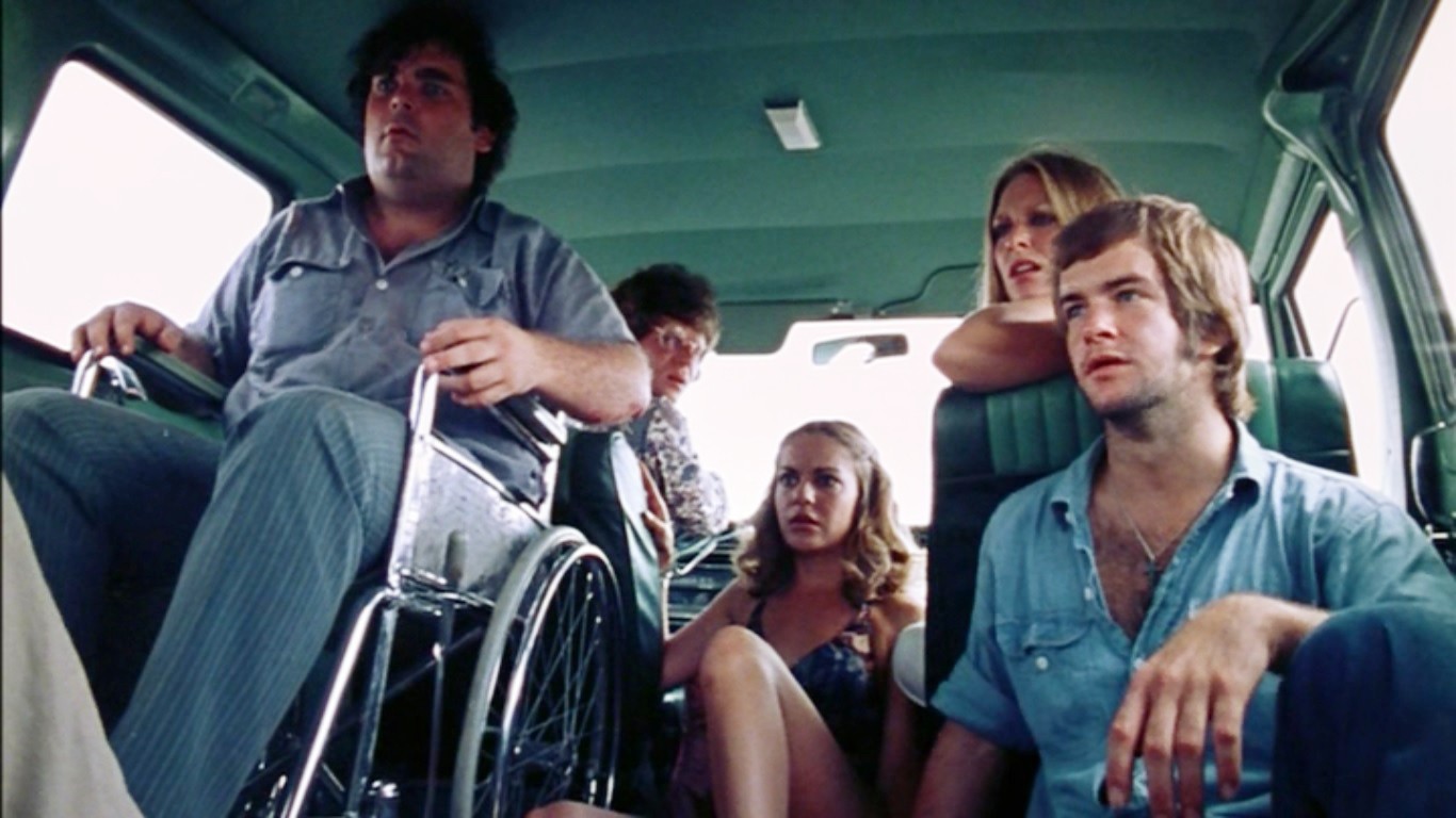 5 friends sit in a van in The Texas Chain Saw Massacre.