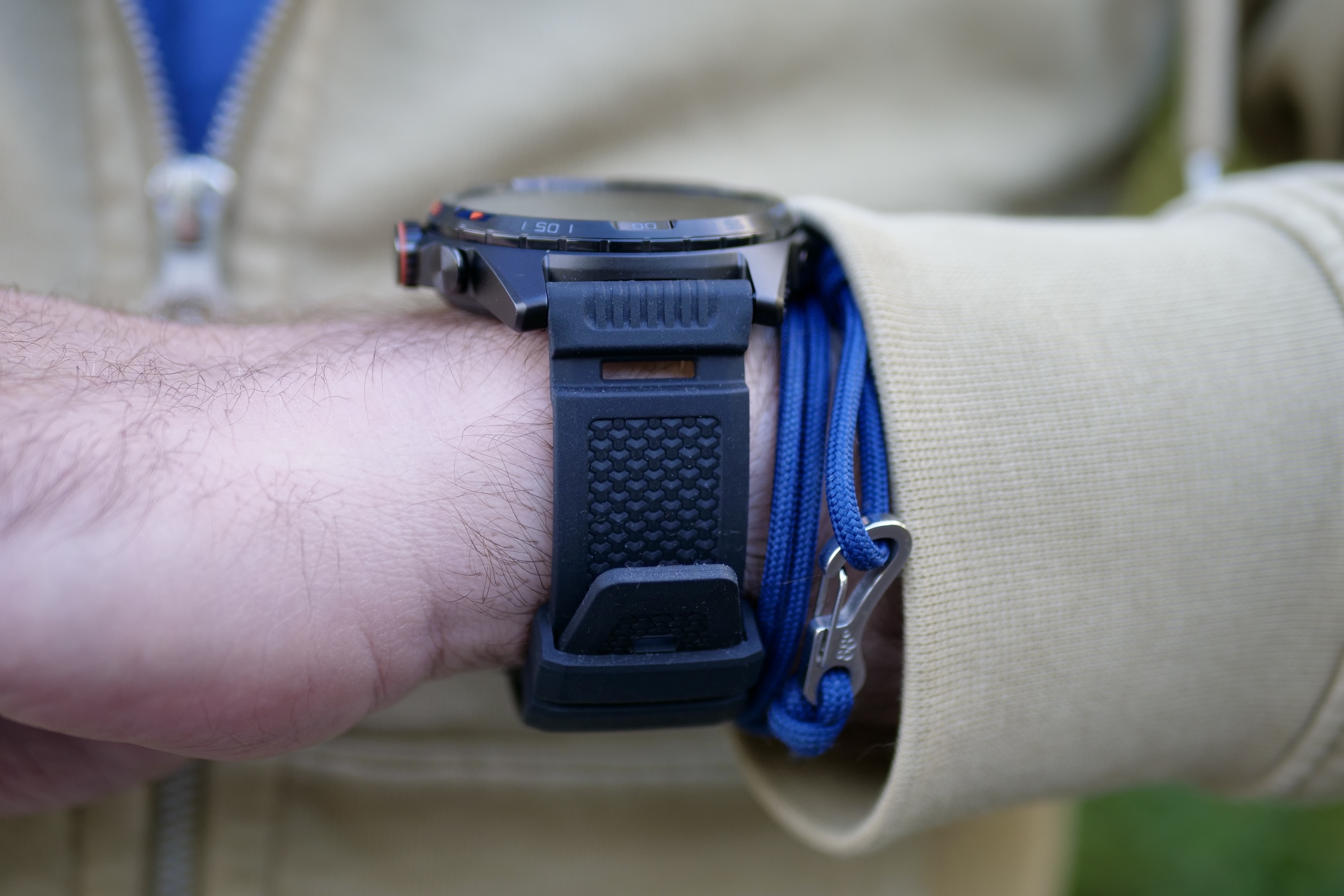 A person wearing the Mobvoi TicWatch Atlas, showing the side of the strap.