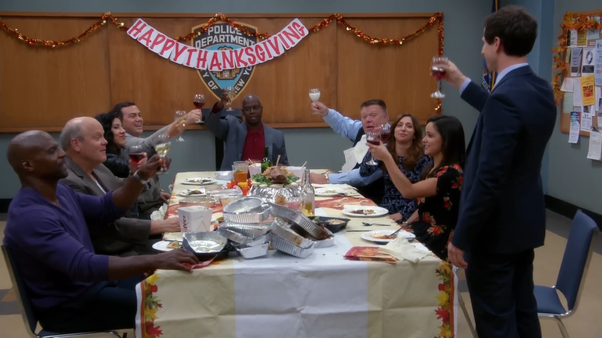 The cast of "Brooklyn Nine-Nine" having a Thanksgiving toast.