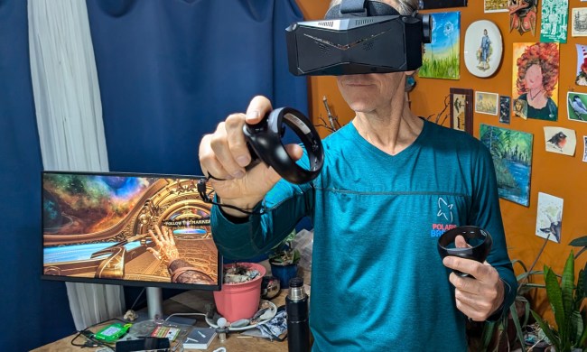 Alan Truly is enjoying a VR game with the Pimax Crystal Light.