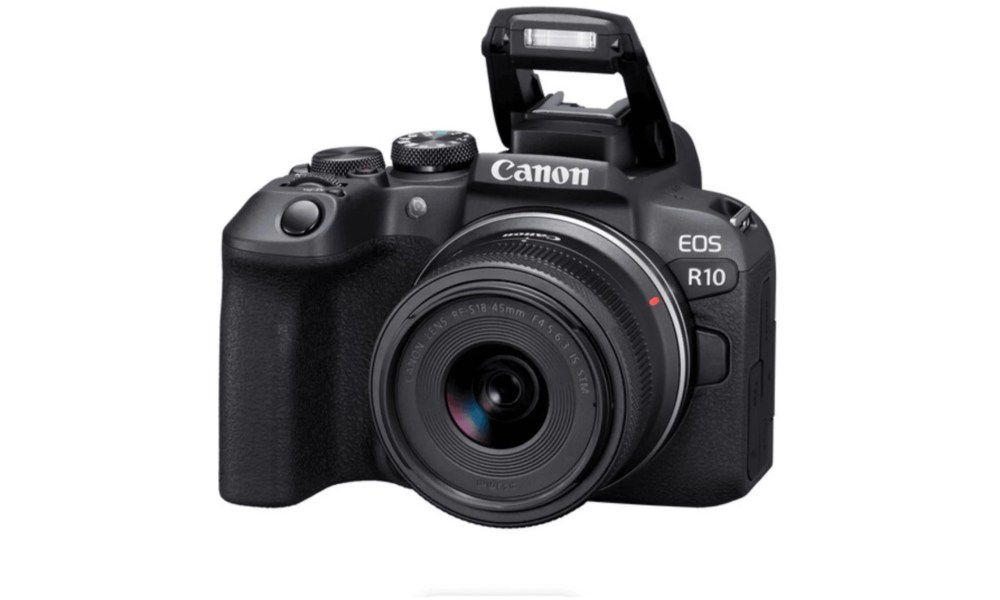 Canon EOS R10 camera mirrorless with STM lens attached and flash up