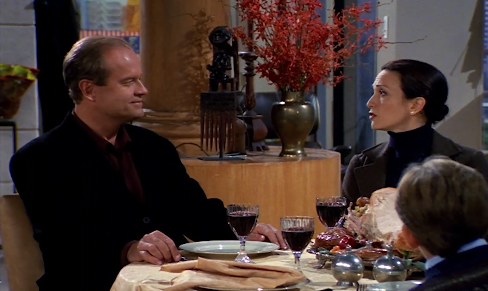 Frasier, Lillith, and Frederick Crane sitting for Thanksgiving dinner in "Frasier."