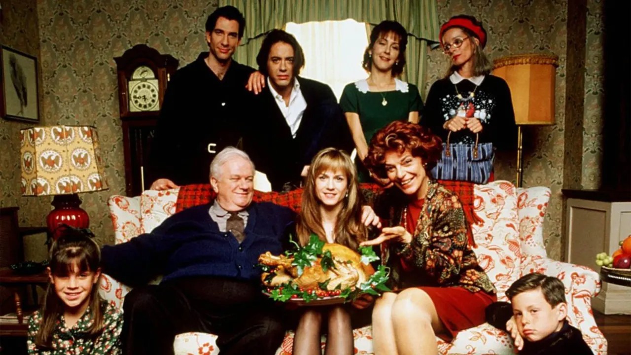 A family poses for a picture in Home for the Holidays.