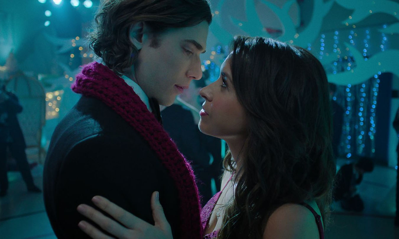 Dustin Milligan leans in for a kiss with Lacey Chabert in Hot Frosty.