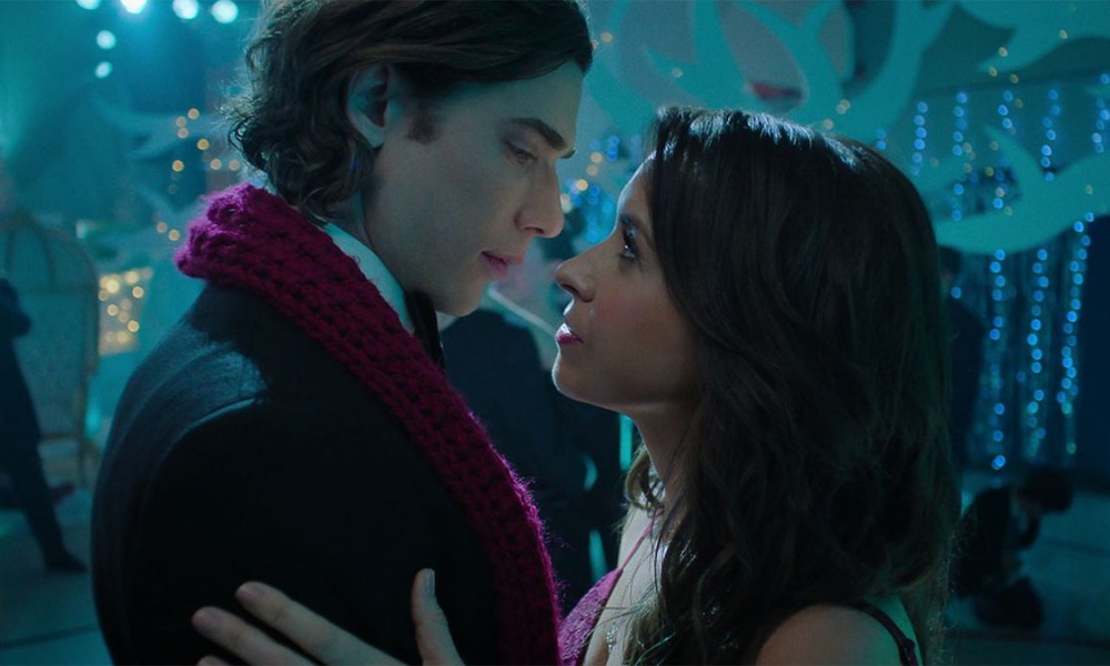 Dustin Milligan leans in for a kiss with Lacey Chabert in Hot Frosty.