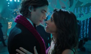 Dustin Milligan leans in for a kiss with Lacey Chabert in Hot Frosty.