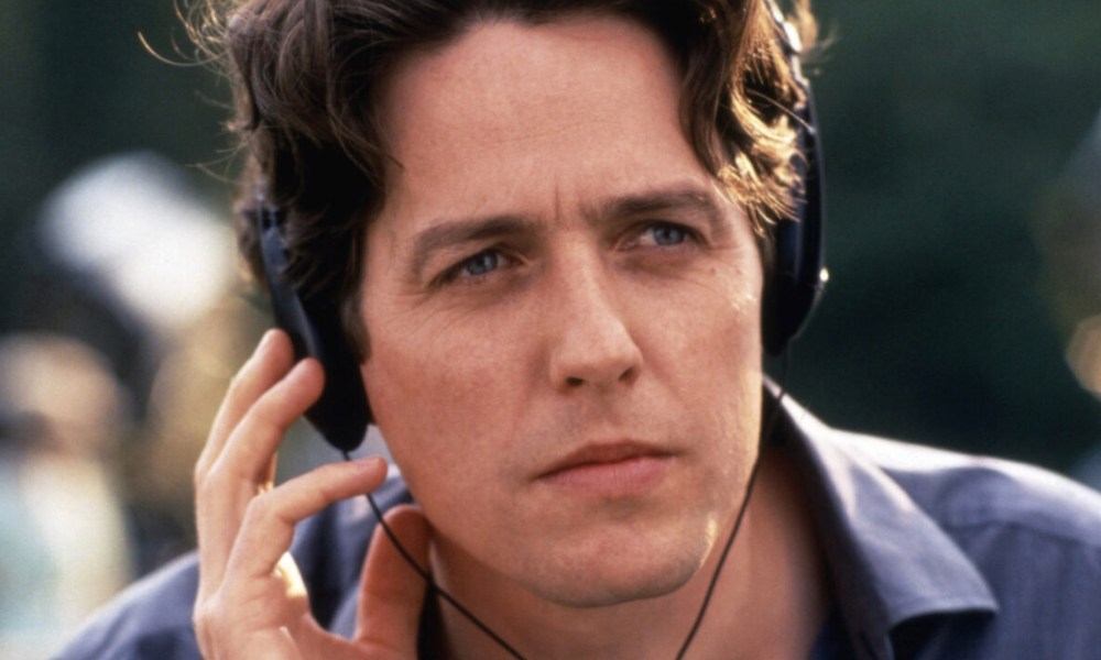 Hugh Grant wears headphones in Notting Hill.