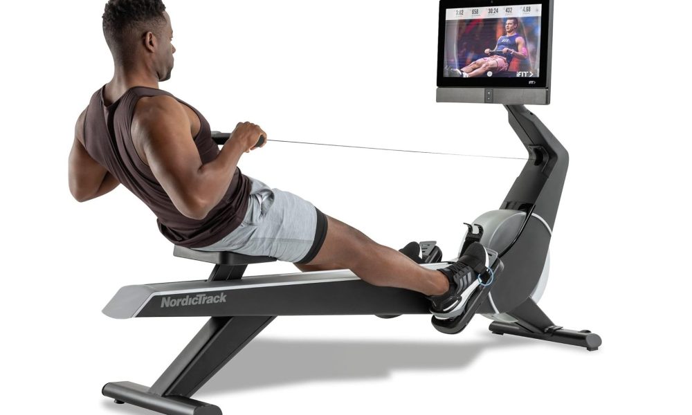 A man working out on the NordicTrack Smart Rower.