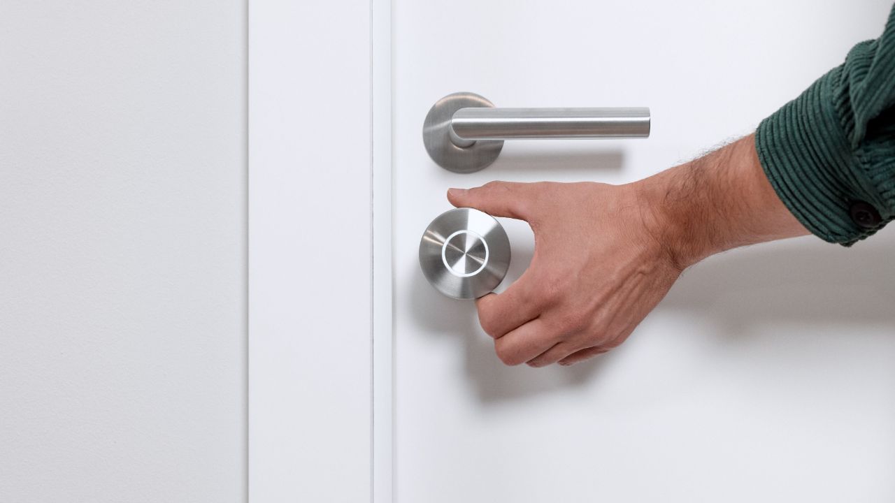 The Nuki Smart Lock Ultra on a door.