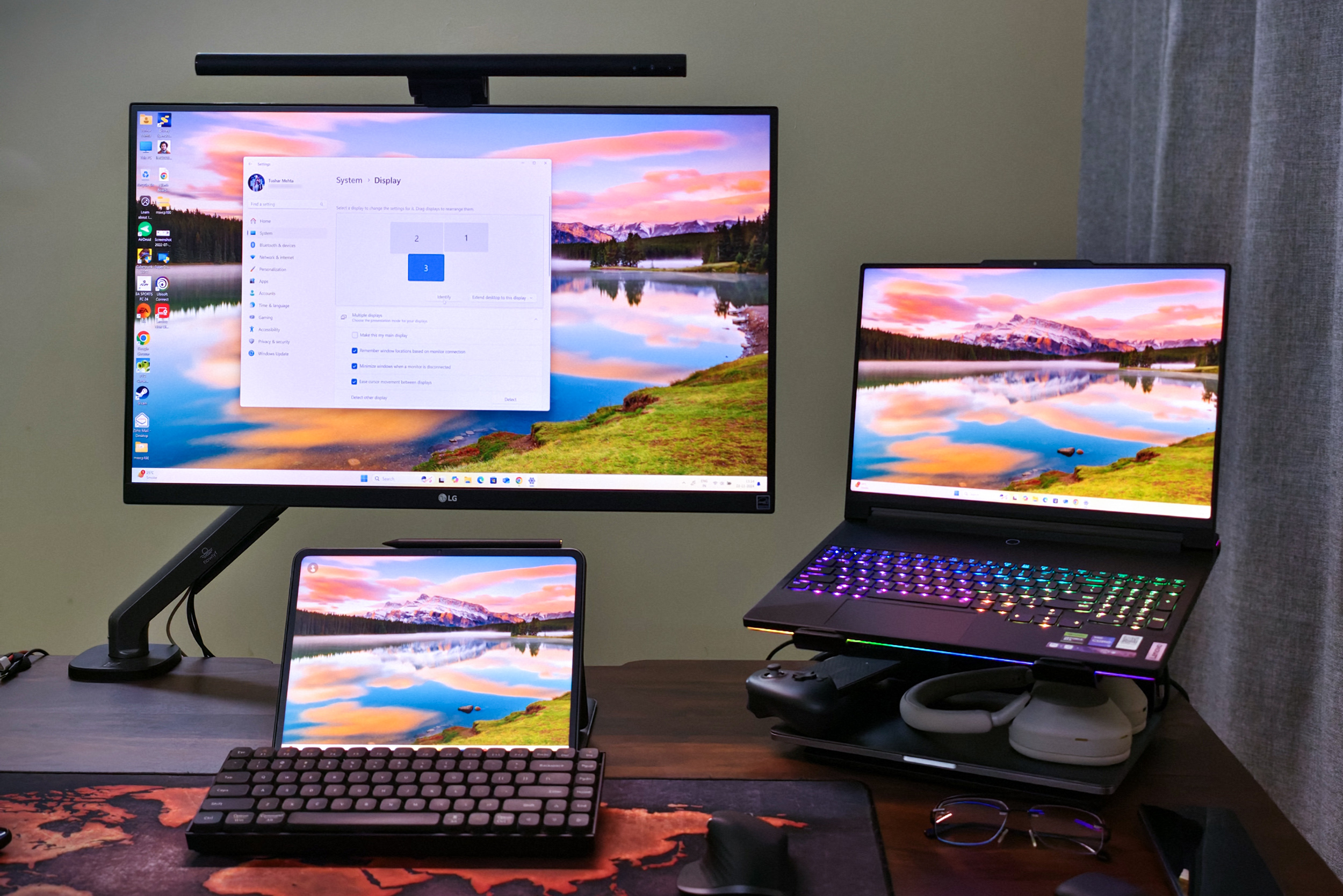 Lenovo Legion 9 laptop attached to an LG 4K monitor and OnePlus Pad 2 used as an external monitor, kept on a desk alongside a Keychron K2V2 mechanical keyboard and a Logitech MX Master 3S mouse.