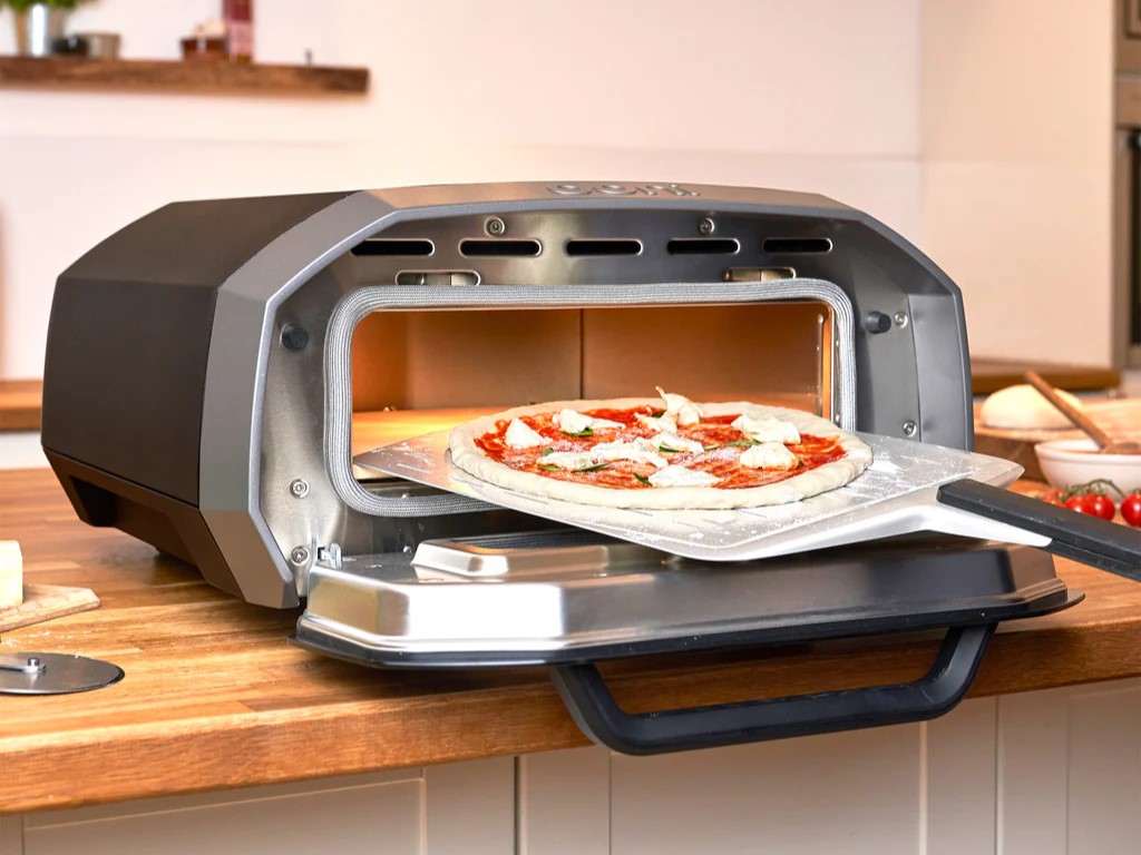 Ooni Volt 12 electric pizza oven used to make food