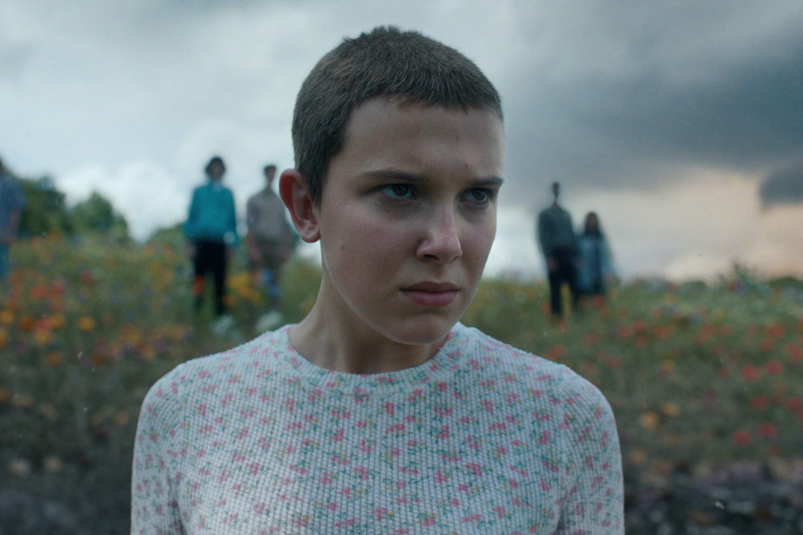 Eleven stands in front of the camera and stares in "Stranger Things."