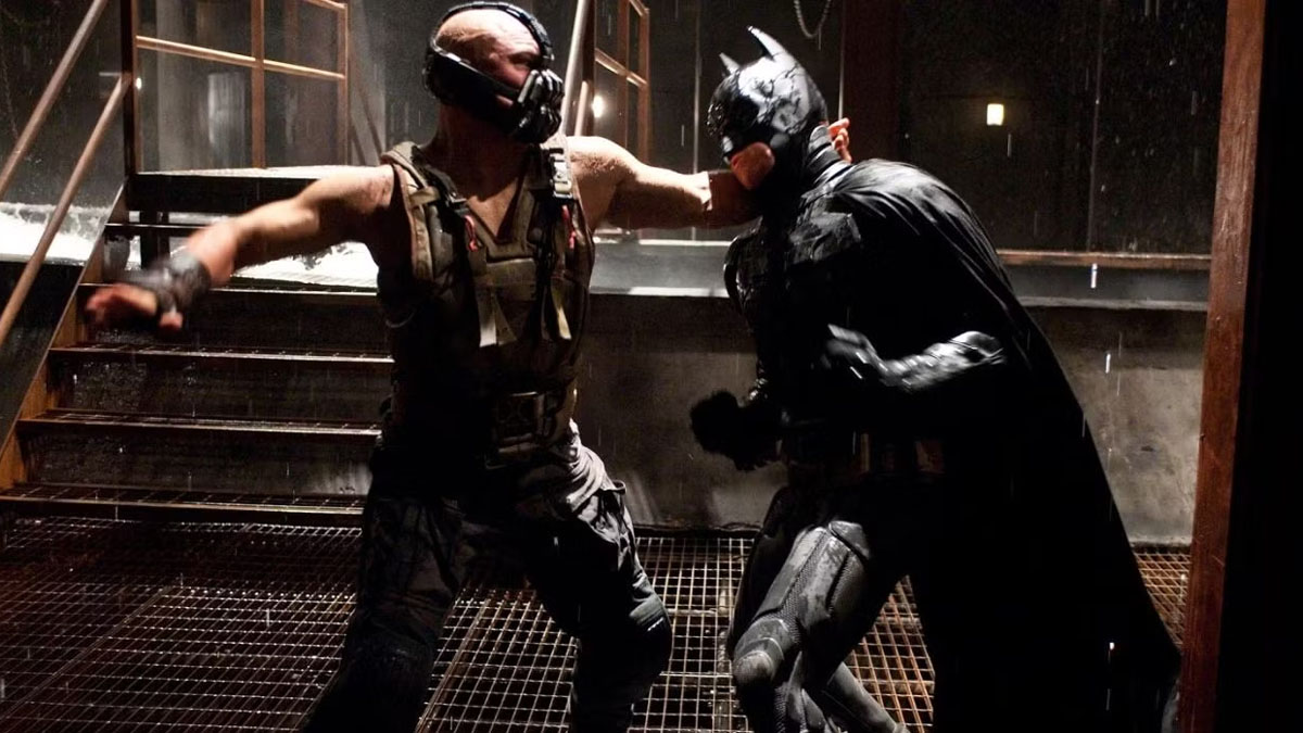 Tom Hardy's Bane fights Christian Bale's Batman in The Dark Knight Rises.