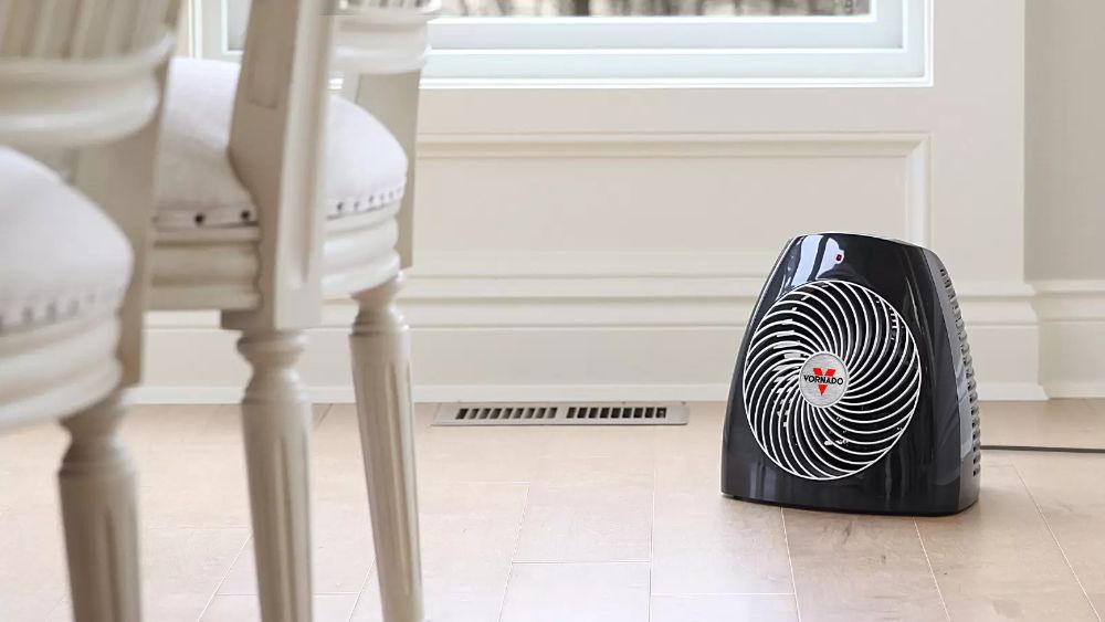 A Vornado heater on the floor.