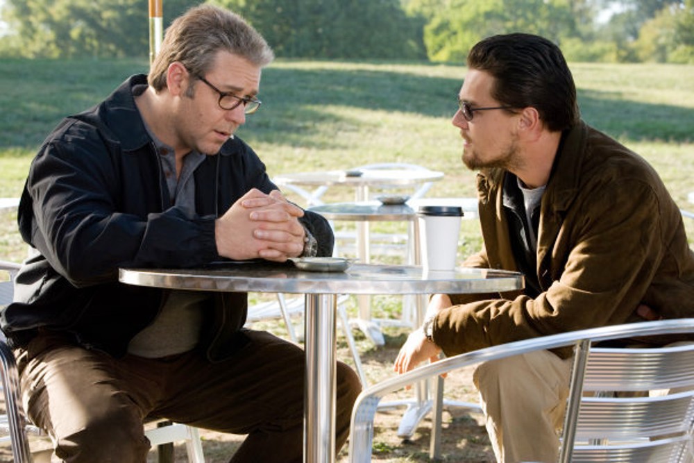 Two men sit and talk in Body of Lies.