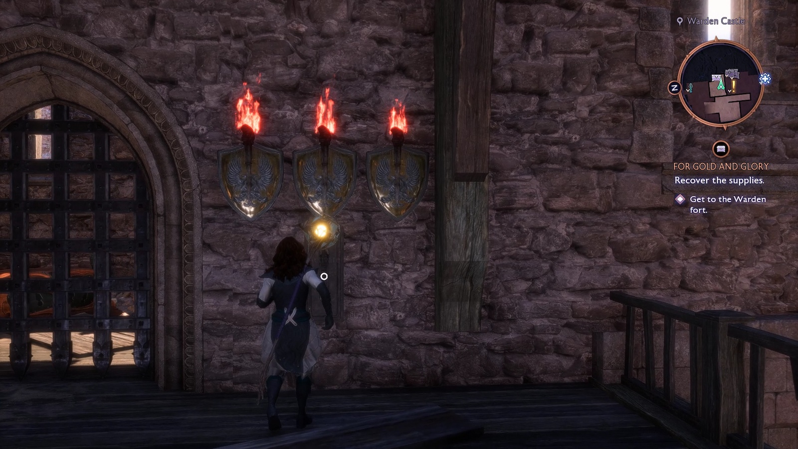 Dragon Age: The Veilguard three torches over a lever puzzle.