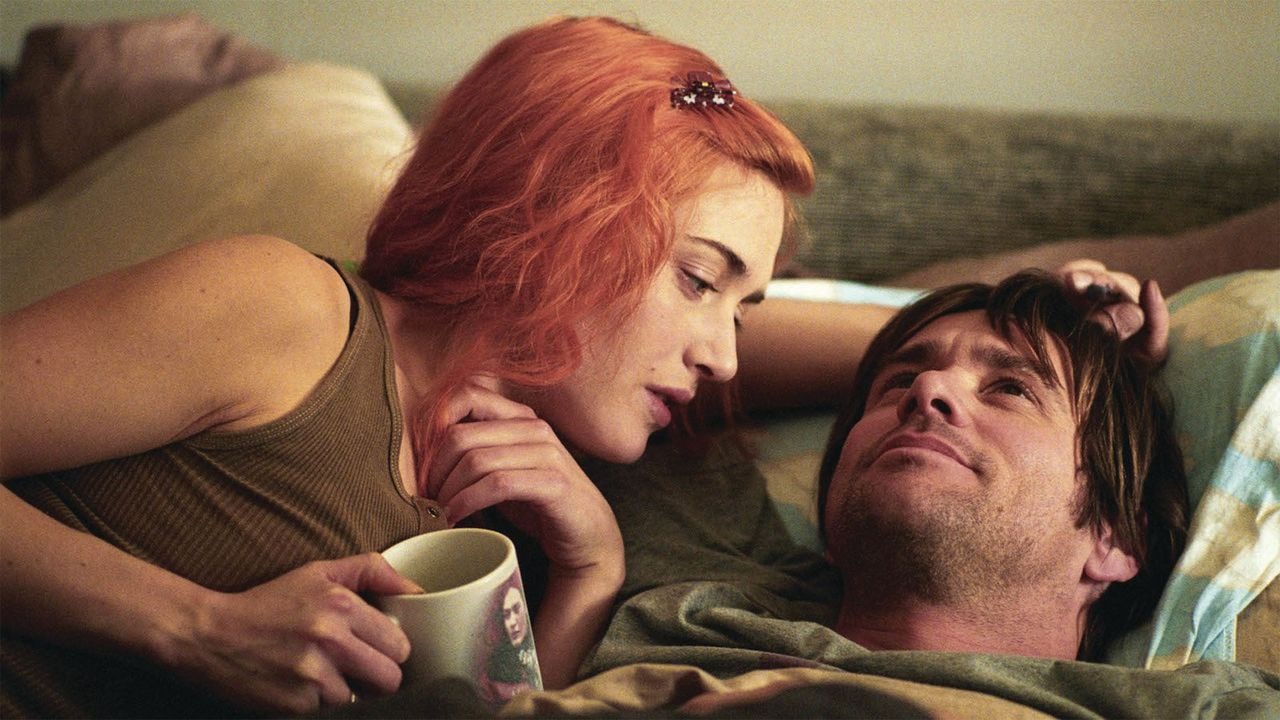 Kate Winslet and Jim Carrey cuddling in a bed in "Eternal radiance of a mind without memories."