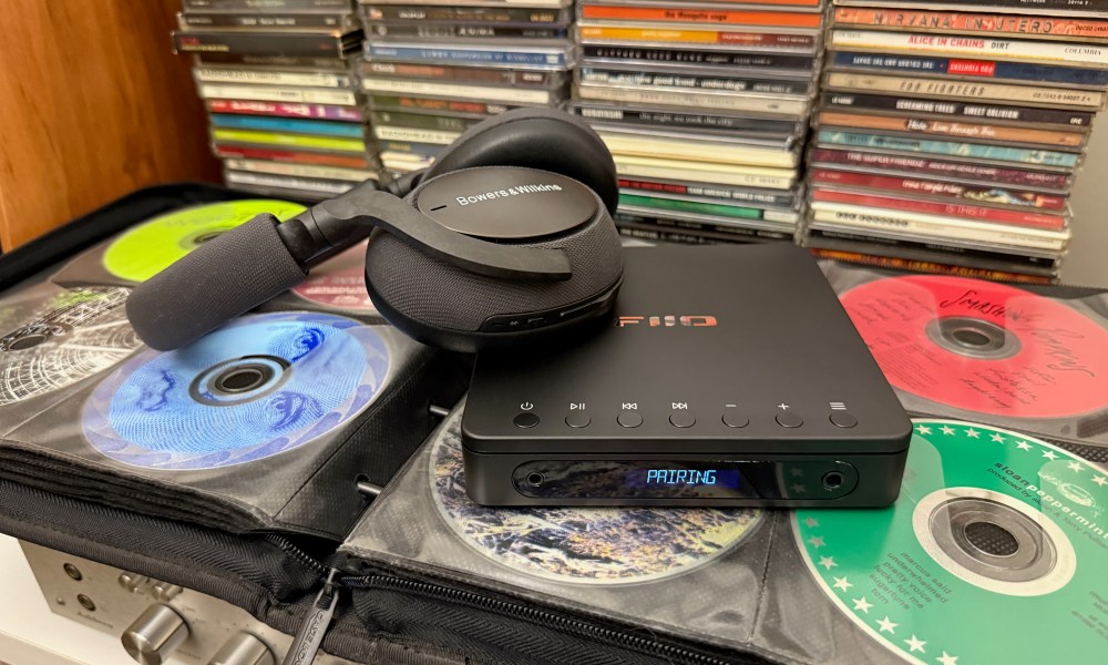 The Fiio dm13 Portable Stereo CD player rtable Stereo CD player with a pair of B&W Px7 Bluetooth headphones.