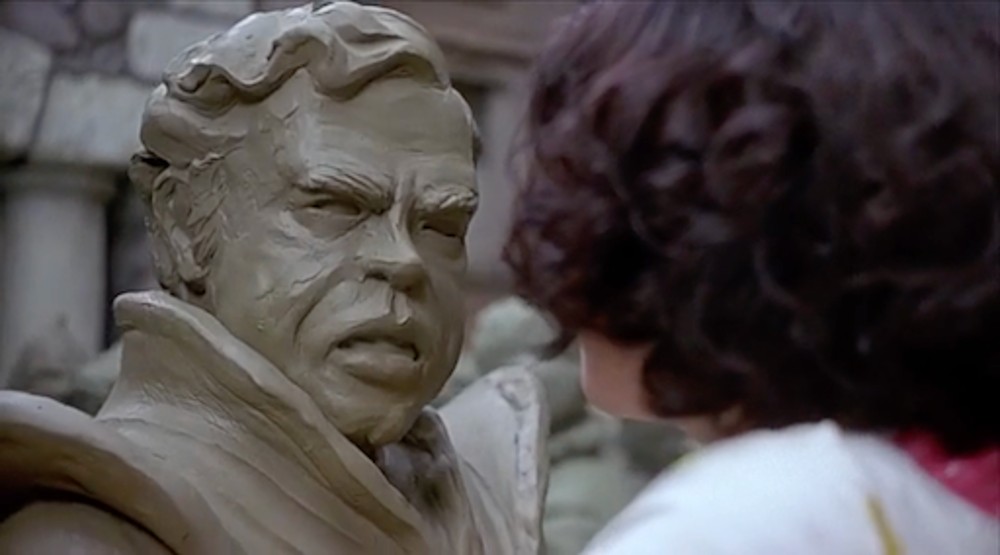 A clay statue looks at a girl in Heavenly Creatures.