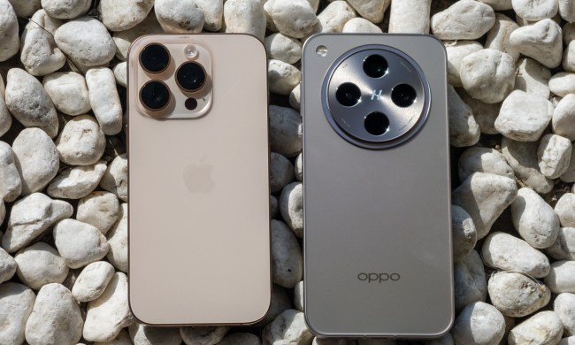 iPhone 16 Pro next to the OPPO Find X8 Pro on a bed of pebbles