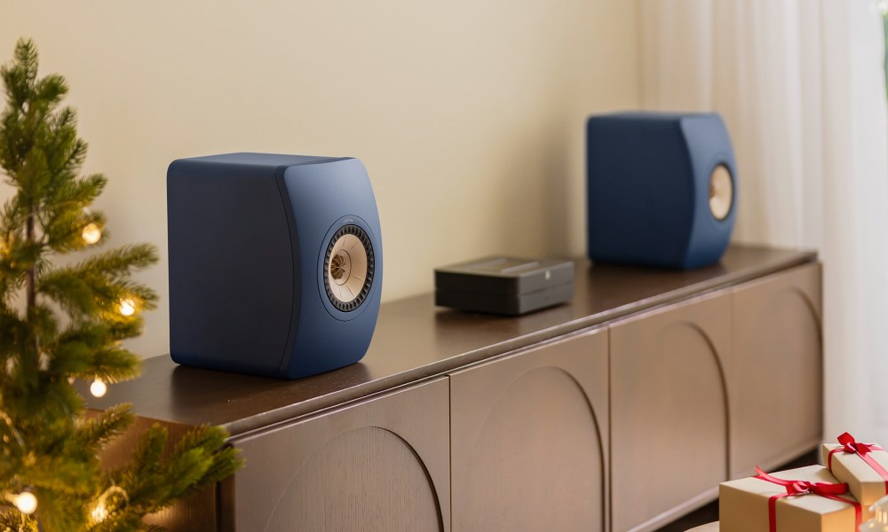 The Royal Blue KEF LS50 Meta bookshelf speakers on a credenza.