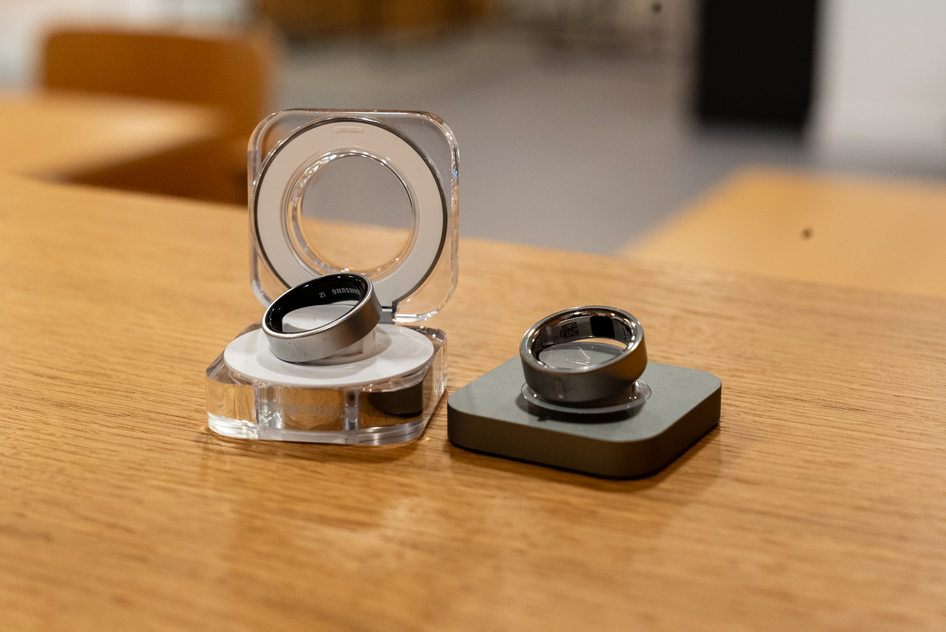 Galaxy Ring charger (left) next to the Oura Ring charger (right)