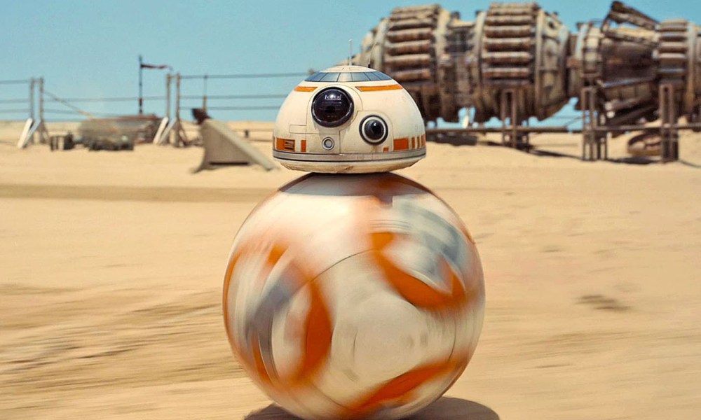 BB-8 rolls across the desert in Star Wars: The Force Awakens.