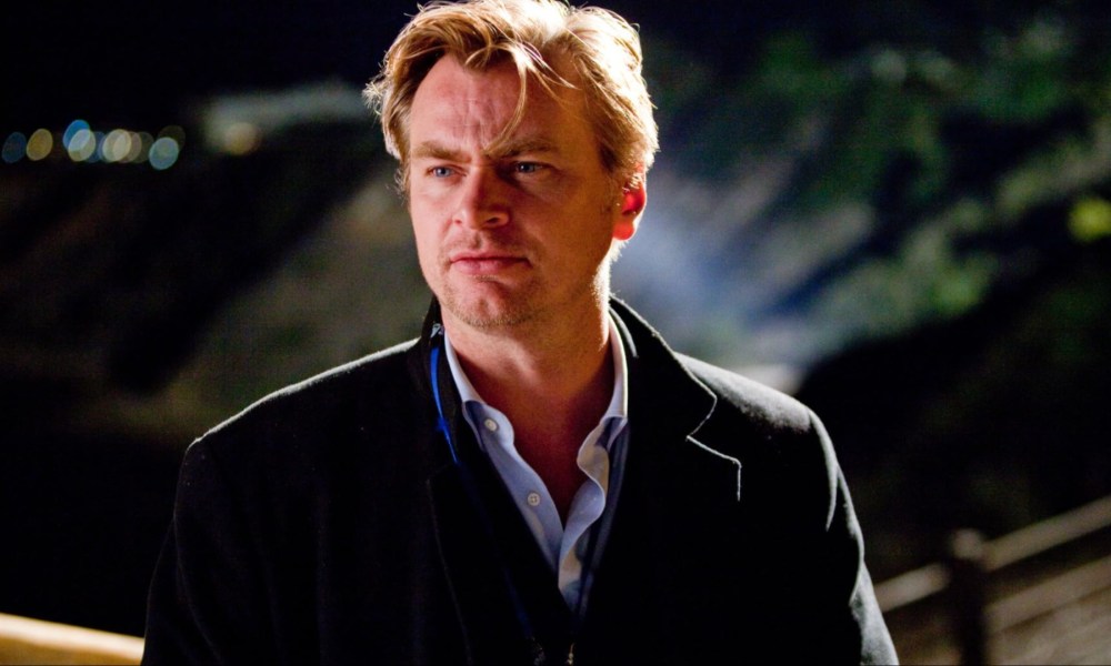 Christopher Nolan stands on set in Inception.