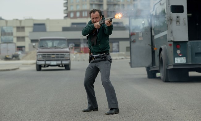 Jude Law fires a shotgun in The Order.