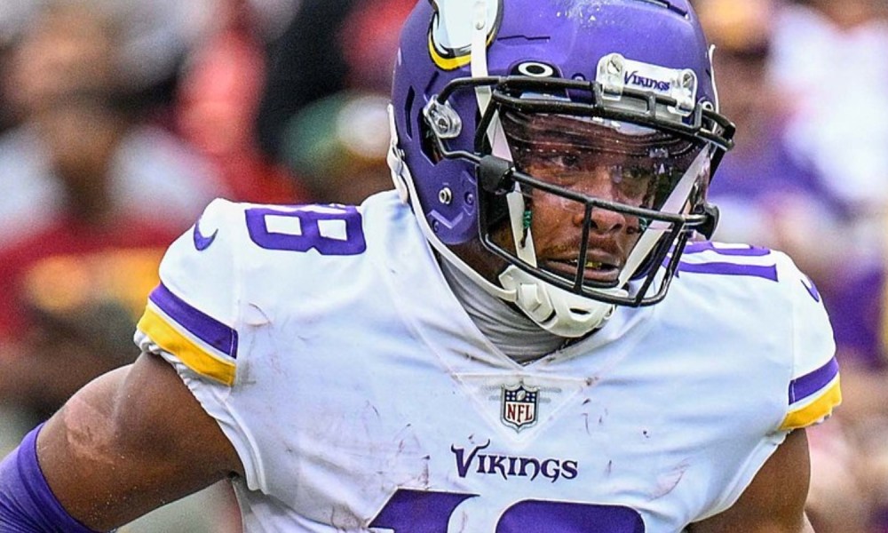 Justin Jefferson of the Vikings runs onto the field.