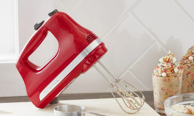 The KitchenAid 3-Speed Hand Mixer on the kitchen counter.