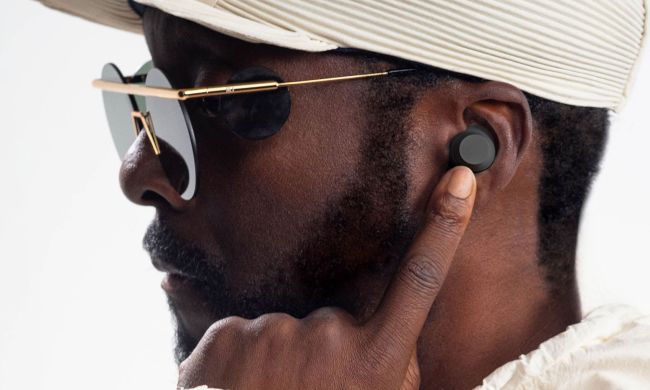 Will.i.am wearing a new xboom by will.i.am earbuds.