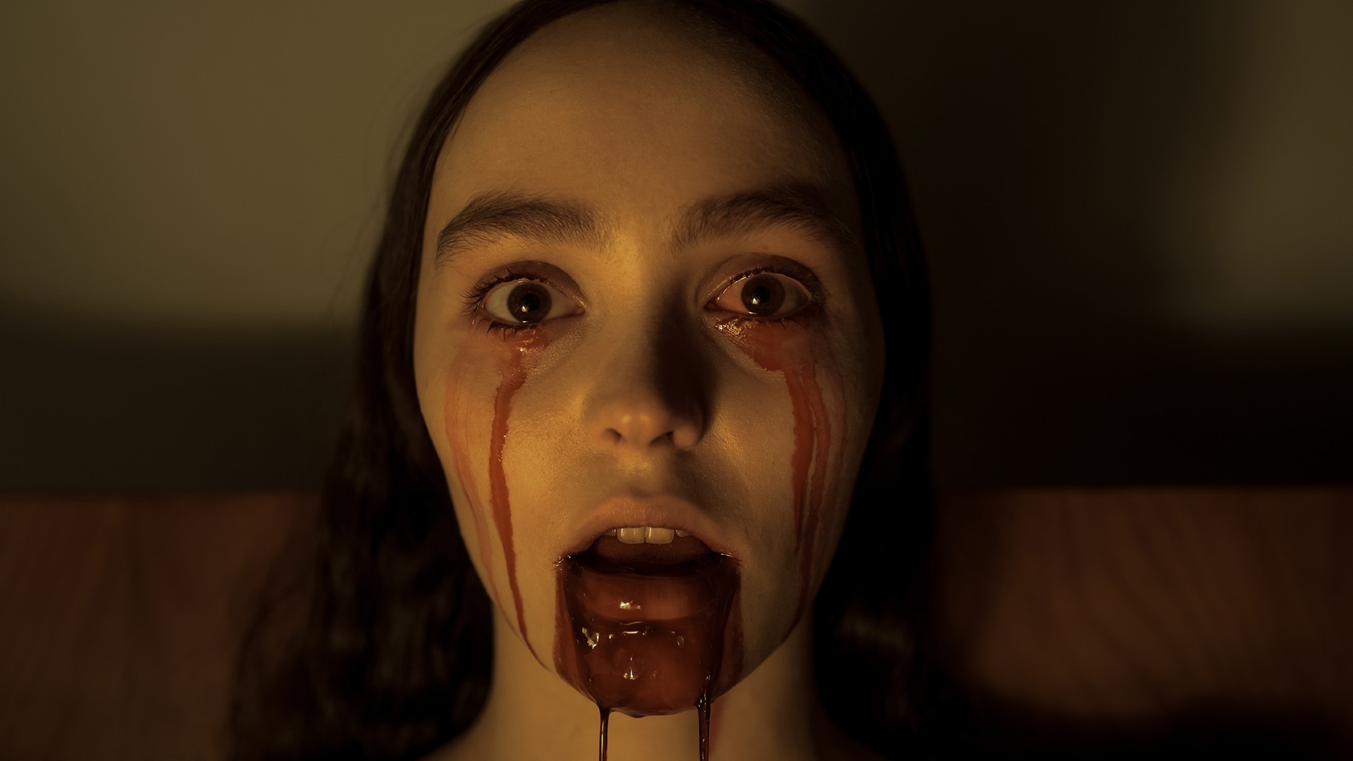 Lily-Rose Depp bleeds from her mouth and eyes in a still from the film "Nosferatu."