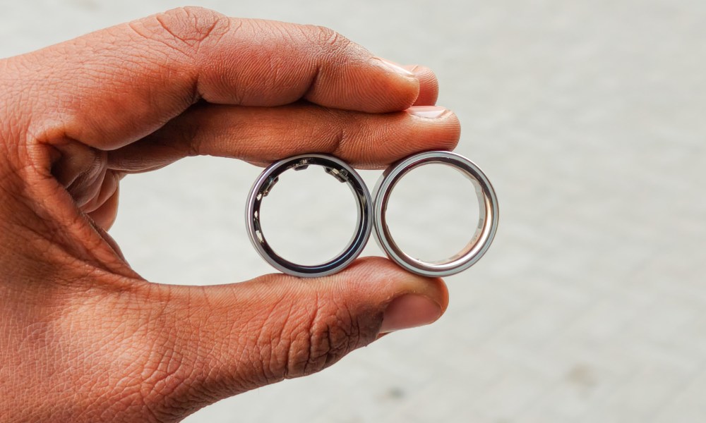 Oura RIng 4 and Galaxy Ring in the hand.