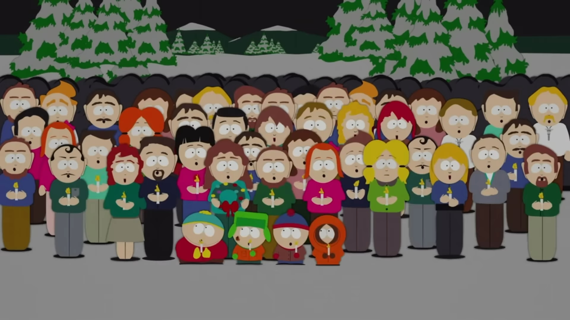 Les habitants de South Park chantent en tenant des bougies dans "South Park".