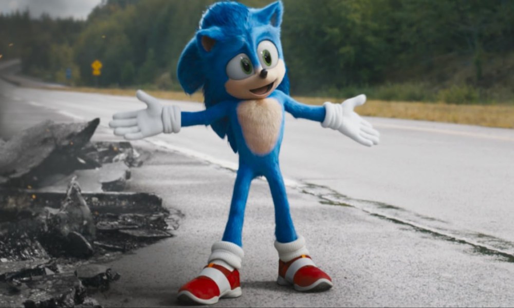 Sonic stands on the road with his arms out in Sonic the Hedgehog.