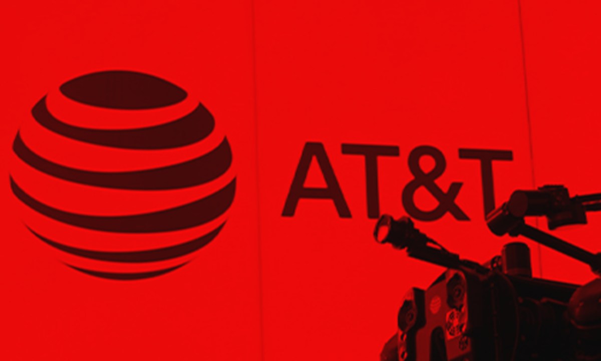 A robot standing a wall with an AT&T branding.