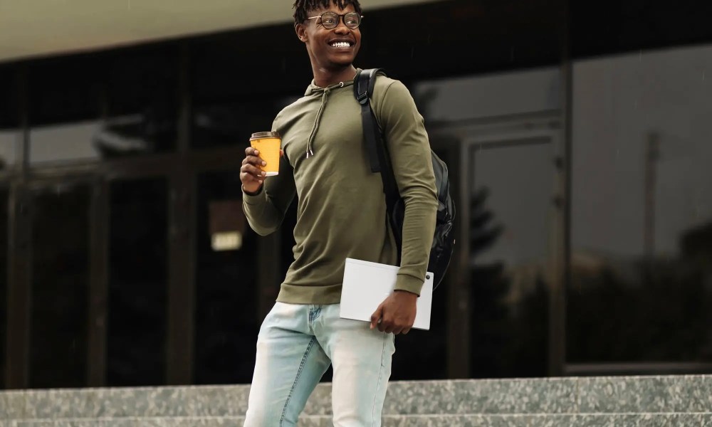 A man holding the Asus Chromebook CM3001 Laptop.