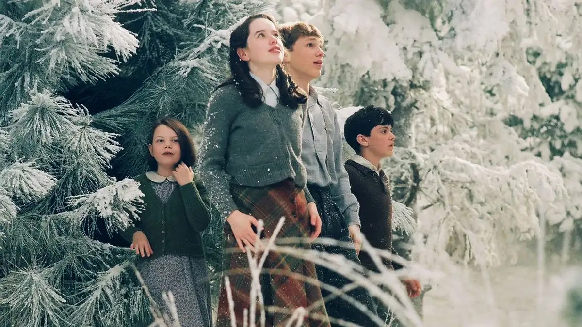 Four children look on in wonder in The Lion, the Witch, and the Wardrobe.