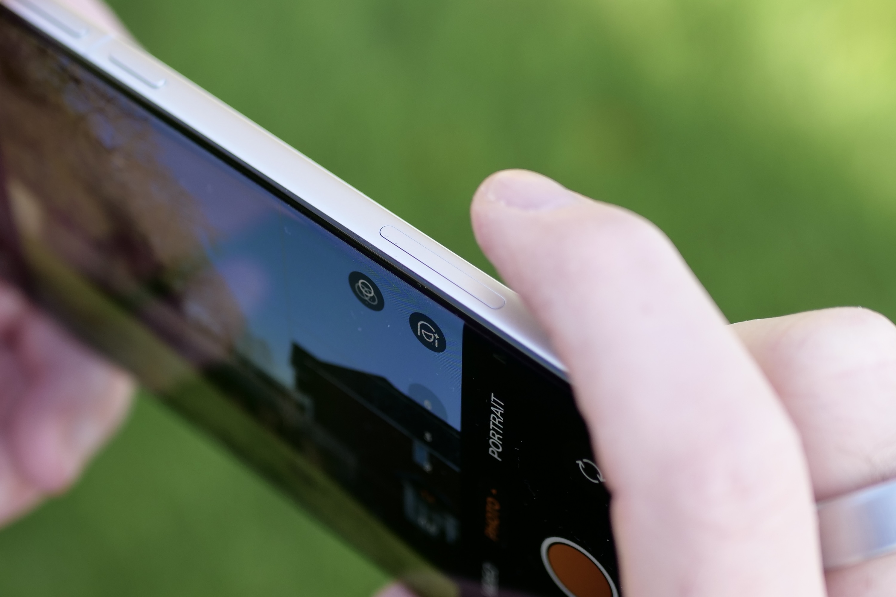 A person using the Oppo Find X8 Pro's Quick Button.