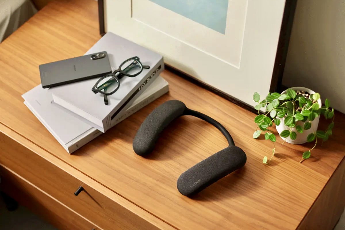 The Sony Bravia Theater U Wearable TV Speaker on a table.