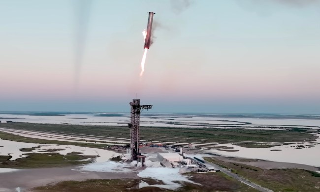 SpaceX's Super Heavy booster being caught by the launch tower for the first time.