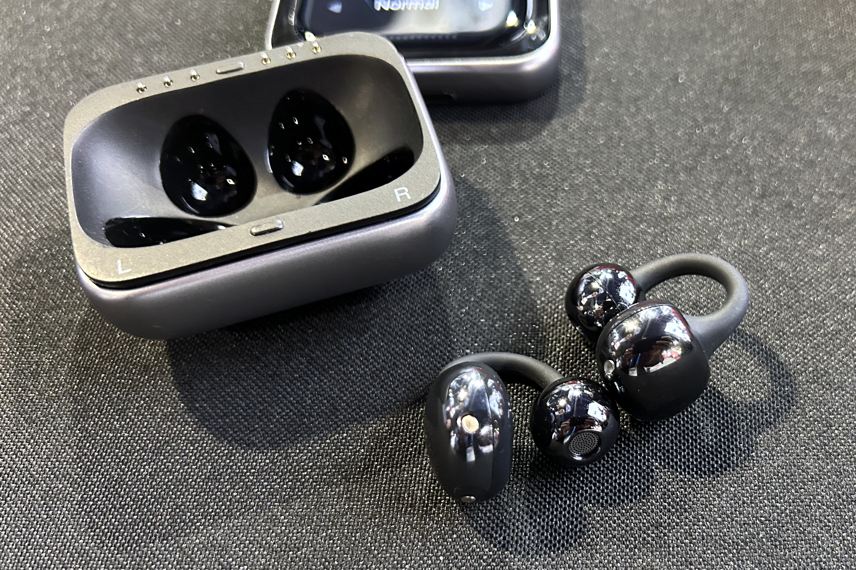 An unreleased and unnamed set of 1More open-ear earbuds at CES 2025.