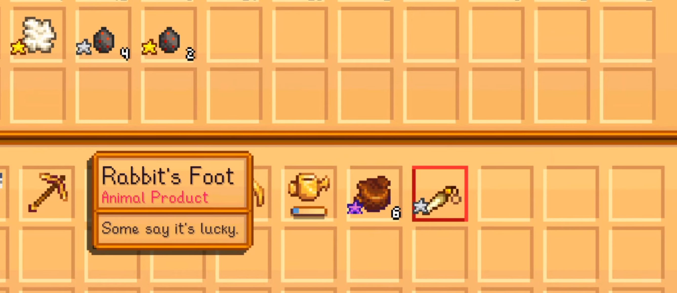 Um inventário em Stardew Valley com pé de coelho.